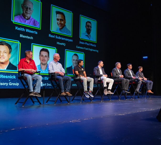 An ICC panel of speakers sitting on stage